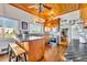 Updated kitchen featuring wood cabinets, stainless steel appliances, and a kitchen island at 214 S Woodland St, Winter Garden, FL 34787