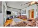 Spacious living room with hardwood floors and comfortable leather sofas at 214 S Woodland St, Winter Garden, FL 34787