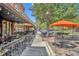 Inviting outdoor patio with cafe seating, perfect for relaxing or dining al fresco at 214 S Woodland St, Winter Garden, FL 34787