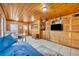 Sunroom with tiled floor, comfortable seating and built-ins at 214 S Woodland St, Winter Garden, FL 34787