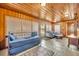 Sunroom with tiled floor, comfortable seating and daybed at 214 S Woodland St, Winter Garden, FL 34787