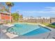 Large kidney-shaped swimming pool in a sunny backyard at 214 S Woodland St, Winter Garden, FL 34787