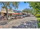 Quaint town square with brick sidewalks, lush landscaping, and inviting shops at 214 S Woodland St, Winter Garden, FL 34787