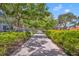 Landscaped walkway with lush greenery in town square at 214 S Woodland St, Winter Garden, FL 34787