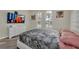 Bedroom with double bed, dresser, and large TV at 360 Tupelo Cir, Davenport, FL 33897