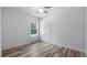 Spacious bedroom with wood-look flooring and a ceiling fan at 40630 E Eighth Ave, Umatilla, FL 32784