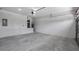 Attached garage with concrete floor and ample space for parking and storage at 40630 E Eighth Ave, Umatilla, FL 32784