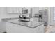 Modern kitchen with stainless steel appliances and granite countertops at 40630 E Eighth Ave, Umatilla, FL 32784