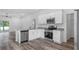 Modern kitchen with stainless steel appliances and granite countertops at 40630 E Eighth Ave, Umatilla, FL 32784