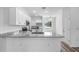 Kitchen with white cabinets, granite countertops, and stainless steel appliances at 40630 E Eighth Ave, Umatilla, FL 32784