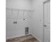Laundry room with wire shelving and hookups at 40630 E Eighth Ave, Umatilla, FL 32784