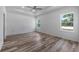 Large main bedroom with two windows and ceiling fan at 40630 E Eighth Ave, Umatilla, FL 32784