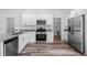 Modern kitchen with granite countertops and stainless steel appliances at 40712 E Ninth Ave, Umatilla, FL 32784