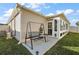 Backyard patio with a swing and access to sunroom at 4414 Cameo Cir, The Villages, FL 32163