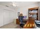 Home office features a spacious desk, comfortable chair, and ample storage at 4414 Cameo Cir, The Villages, FL 32163