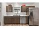Kitchen boasts stainless steel appliances and white countertops at 4414 Cameo Cir, The Villages, FL 32163