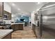 Open concept kitchen with island and stainless steel appliances at 4414 Cameo Cir, The Villages, FL 32163