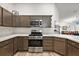 Modern kitchen with stainless steel appliances and ample cabinetry at 4414 Cameo Cir, The Villages, FL 32163
