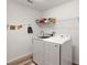 Laundry room with washer, dryer, and shelving at 4414 Cameo Cir, The Villages, FL 32163