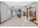 Spacious home interior with a circular elevator, hardwood floors, and a staircase at 501 Gibson St, Leesburg, FL 34748