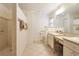 Large bathroom with double vanity, walk-in shower, and toilet at 5107 Aurora Dr, Leesburg, FL 34748
