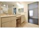 Elegant bathroom with double sinks and a view into another room at 5107 Aurora Dr, Leesburg, FL 34748