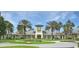 Community clubhouse with clock tower and landscaping at 5107 Aurora Dr, Leesburg, FL 34748