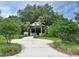 Attractive community entrance with a gazebo and landscaping at 5107 Aurora Dr, Leesburg, FL 34748