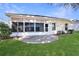 Single-story home with a screened patio and yard at 5107 Aurora Dr, Leesburg, FL 34748