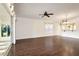 Living room with dark hardwood floors and ceiling fan at 5107 Aurora Dr, Leesburg, FL 34748
