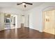 Spacious living area with wood floors and access to a sunroom at 5107 Aurora Dr, Leesburg, FL 34748