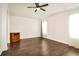 Bright living room featuring hardwood floors and a ceiling fan at 5107 Aurora Dr, Leesburg, FL 34748