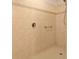 Walk-in shower with tiled walls and grab bar at 5107 Aurora Dr, Leesburg, FL 34748
