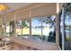 Sunroom showcasing a pond and lush landscape views at 5107 Aurora Dr, Leesburg, FL 34748