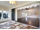 Sunroom with tiled floors and access to the living room at 5107 Aurora Dr, Leesburg, FL 34748