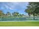 Community tennis courts with surrounding landscape at 5107 Aurora Dr, Leesburg, FL 34748
