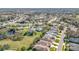 Aerial view of a residential neighborhood with houses and green spaces at 5401 Water Lily Ct, Leesburg, FL 34748