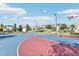 Community basketball court with two hoops and ample playing space at 840 Pebble Beach Dr, Davenport, FL 33896