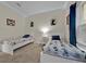 Bright bedroom with twin beds, nightstands, and Mickey Mouse themed bedding at 840 Pebble Beach Dr, Davenport, FL 33896