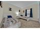 Bedroom with two twin beds, Mickey Mouse bedding, and blue curtains at 840 Pebble Beach Dr, Davenport, FL 33896