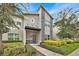 Modern two-story home with stone accents and landscaped front yard at 840 Pebble Beach Dr, Davenport, FL 33896