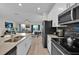 Modern kitchen with stainless steel appliances and island at 840 Pebble Beach Dr, Davenport, FL 33896