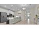 Modern kitchen with stainless steel appliances and breakfast bar at 840 Pebble Beach Dr, Davenport, FL 33896