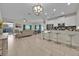 Open living room and kitchen with tile floors and modern furnishings at 840 Pebble Beach Dr, Davenport, FL 33896