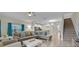 Spacious living room with L-shaped sofa and modern coffee table at 840 Pebble Beach Dr, Davenport, FL 33896