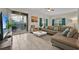 Living room with sectional sofa and access to backyard patio at 840 Pebble Beach Dr, Davenport, FL 33896