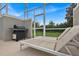 Relaxing poolside patio with lounge chairs and a gas grill at 840 Pebble Beach Dr, Davenport, FL 33896