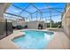 Private screened pool and spa with patio furniture and grill at 840 Pebble Beach Dr, Davenport, FL 33896