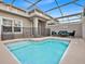 Enclosed private pool with patio furniture for relaxing at 840 Pebble Beach Dr, Davenport, FL 33896
