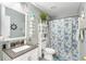 Charming bathroom with a nautical theme, shower/tub combo, and updated vanity at 1087 Welch Hill Cir, Apopka, FL 32712